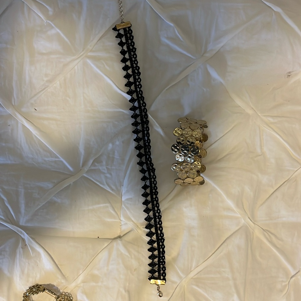 Black choker and gold stretch bracelet.  Good condition.
